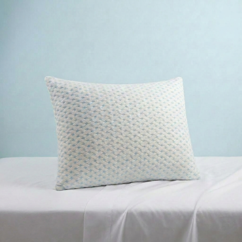 Welcari pillow on a bed against a soft blue wall